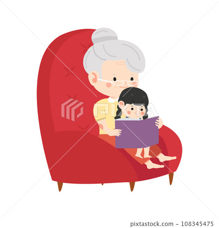 grandmother sits in a chair and reads a book to her granddaughter grandmother sits in a chair and reads a book to her granddaughter 108345475