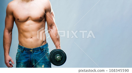 muscular man on gray background 108345590