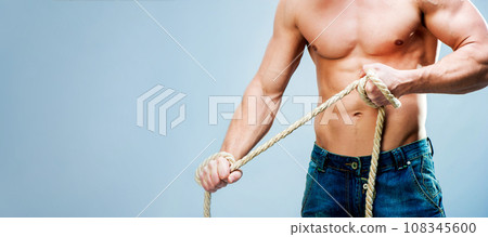 muscular man on gray background muscular man on gray background 108345600