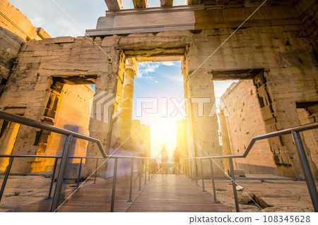 Tourists pass through the Propylaea entrance to the Parthenon, motion blur 108345628
