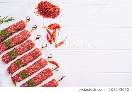 Raw kebab with spices Raw kebab with spices 108345660