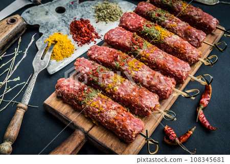 Raw kebab with spices 108345681