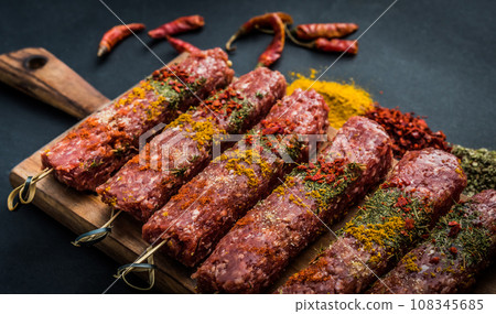 Raw kebab with spices Raw kebab with spices 108345685