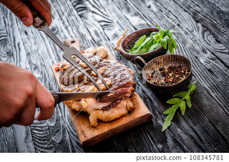 Grilled meat on a table Grilled meat on a table 108345781