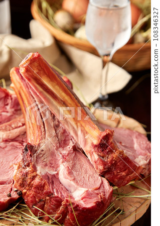 Roasted lamb rack sliced on wooden plate 108346327