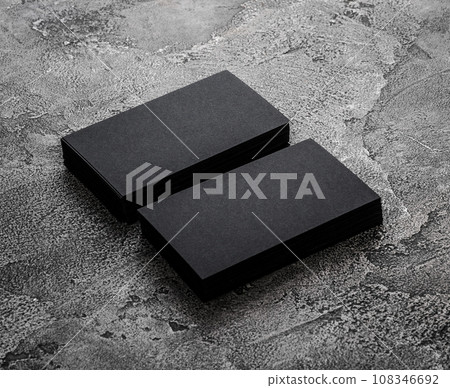 Stacks of black blank business cards on textured background 108346692