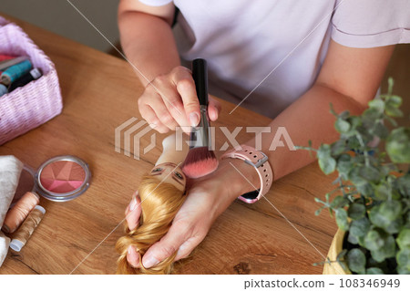 Creative woman painting handmade doll face. Creative woman painting handmade doll face. 108346949