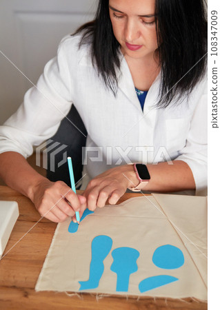 Creative woman working on sewing patterns. 108347009