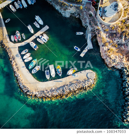 Small motorboats moored at dock, Paros island, Greece, view from above 108347033