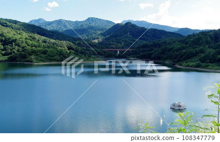 Dam lake of Otani dam, Lake Himesayuri and Morimon mountain massif 108347779