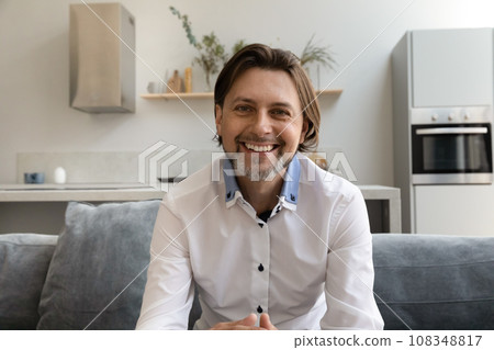 Positive handsome 40s blogger, business man making video call Positive handsome 40s blogger, business man making video call 108348817