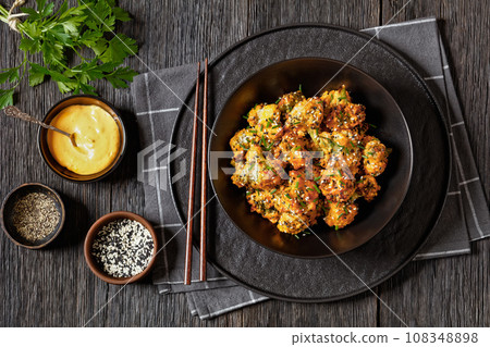 bang bang broccoli bites in bowl, top view bang bang broccoli bites in bowl, top view 108348898