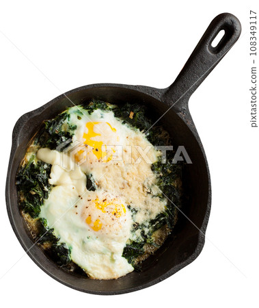 Fried eggs with spinach Fried eggs with spinach 108349117