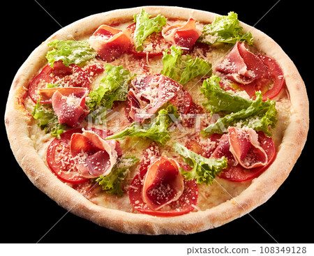 Pizza with prosciutto, lettuce salad and parmesan. 108349128