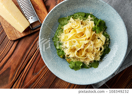 Fettuccine pasta with pesto sauce. 108349232