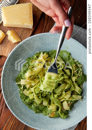 Fettuccine pasta with pesto sauce. Fettuccine pasta with pesto sauce. 108349347
