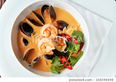 Spicy Thai soup Tom Yam with seafoods. Spicy Thai soup Tom Yam with seafoods. 108349349
