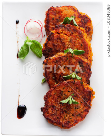 Fried salmon and sweet potato patties 108349369