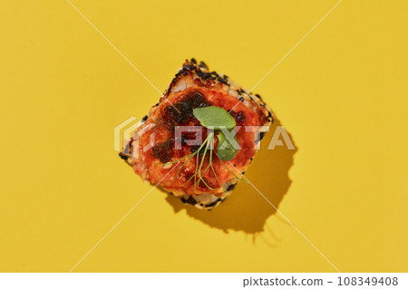Hot baked suchi roll with salmon on yellow background. 108349408