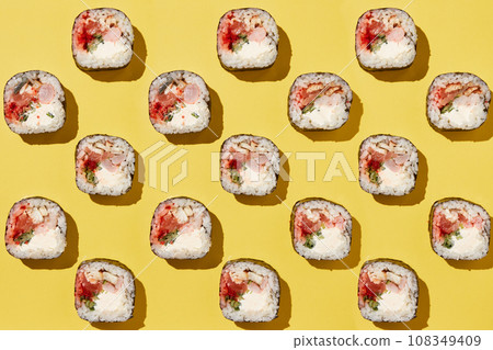 Sushi rolls pattern on yellow background. 108349409