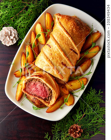 Classic steak dish beef wellington with potato. 108349434