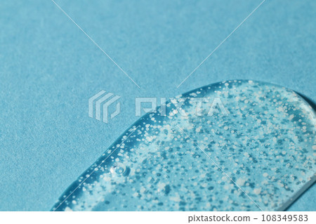 Smoothing scrub wash gel drop on blue background. Smoothing scrub wash gel drop on blue background. 108349583