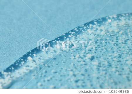 Smoothing scrub wash gel drop on blue background. 108349586