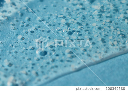 Smoothing scrub wash gel drop on blue background. 108349588