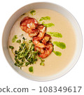 Creamy cheese soup with grilled shrimps 108349617
