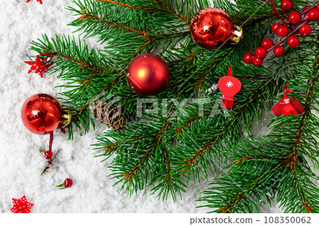 Christmas decorations. Christmas 2023 2024. Big set of Christmas fir garlands with berries and red cones. Close the balls on the Christmas tree. Bokeh grains in the background. New Year concept. Christmas decorations. Christmas 2023 2024. Big set of Christmas fir garlands with berries and red cones. Close the balls on the Christmas tree. Bokeh grains in the background. New Year concept. 108350062