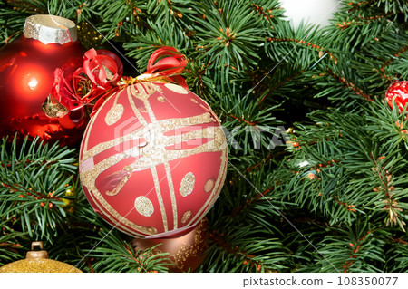 Christmas decorations. Christmas 2023 2024. Big set of Christmas fir garlands with berries and red cones. Close the balls on the Christmas tree. Bokeh grains in the background. New Year concept. Christmas decorations. Christmas 2023 2024. Big set of Christmas fir garlands with berries and red cones. Close the balls on the Christmas tree. Bokeh grains in the background. New Year concept. 108350077