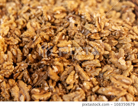 Closeup of Peeled Walnuts Pile. Many Different Textured Walnuts. Walnuts Background. Selling shelled nuts at the market Closeup of Peeled Walnuts Pile. Many Different Textured Walnuts. Walnuts Background. Selling shelled nuts at the market 108350679
