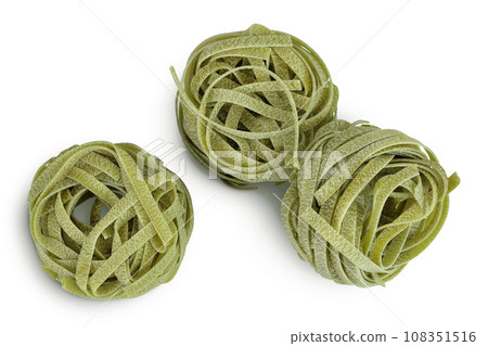 Raw tagliatelle green pasta with spinach isolated on white background. Top view. Flat lay 108351516