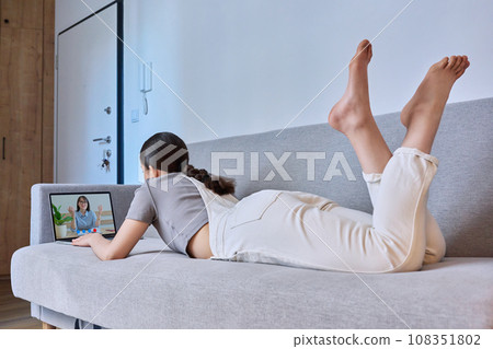 Young female on online therapy session with psychologist Young female on online therapy session with psychologist 108351802