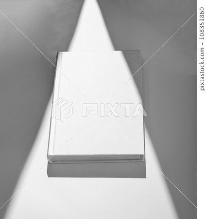 Hardcover Book Mockup in sun light beam. Blank Canvas Cover Hardcover Book Mockup in sun light beam. Blank Canvas Cover 108351860