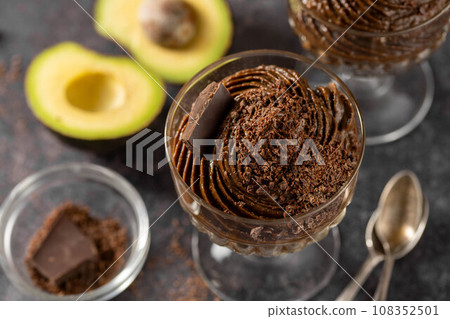 Avocado chocolate mousse pudding, keto vegan healthy dessert. Avocado chocolate mousse pudding, keto vegan healthy dessert. 108352501