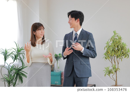 Business people and men discussing with each other in the office 4 Business people and men discussing with each other in the office 4 108353476
