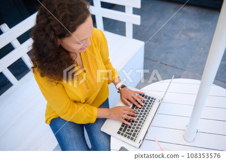 Top view multi-ethic female entrepreneur, freelancer working remotely on laptop. Online business Career People Internet Top view multi-ethic female entrepreneur, freelancer working remotely on laptop. Online business Career People Internet 108353576
