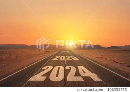 New year 2024 or straight forward concept. Text 2024 written on the road in the middle of asphalt road at sunset. Concept of planning, goal, challenge, new year resolution. 108353755