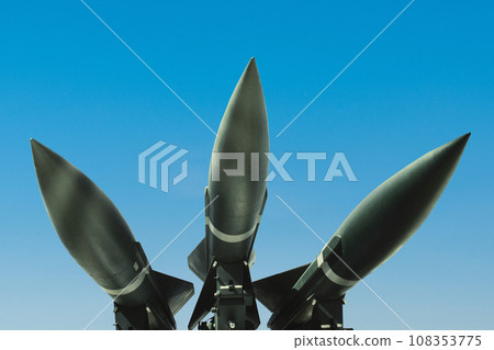 Three missiles weapons rockets on a blue sky, concept. War in Israel and Palestine. Armed conflict Three missiles weapons rockets on a blue sky, concept. War in Israel and Palestine. Armed conflict 108353775