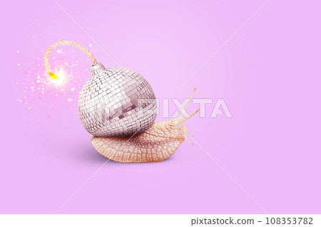 Creative snail with a mirror ball bomb with sparks on a pink background, concept. Contemporary art collage. Creative colorful design with snail and disco ball. Party time. Concept New Year 108353782