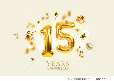 Gold festive balloons 15 years anniversary with golden confetti, presents, mirror ball and stars fly on a beige background with bokeh lights and sparks. Birthday luxury fifteen card, a creative idea 108353809