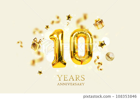 Gold festive balloons 10 years anniversary with golden confetti, presents, mirror ball and stars fly on a beige background with bokeh lights and sparks. Birthday luxury ten card, a creative idea 108353846