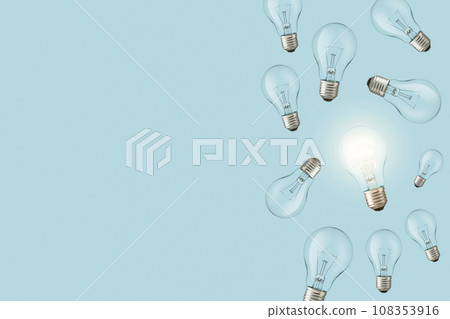 Light bulbs on a blue background and one creative glowing light bulb. Creative idea, concept. Electricity and think differently. Light bulbs on a blue background and one creative glowing light bulb. Creative idea, concept. Electricity and think differently. 108353916