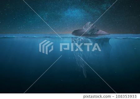 Tip of a drifting iceberg in the water and underwater view on a starry night in the ocean. Global warming and melting glaciers, concept. Danger, creative idea. Iceberg at night Tip of a drifting iceberg in the water and underwater view on a starry night in the ocean. Global warming and melting glaciers, concept. Danger, creative idea. Iceberg at night 108353933