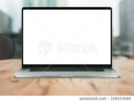 Laptop with white screen mockup on desktop with urban view. Creative idea and work in office 108353980