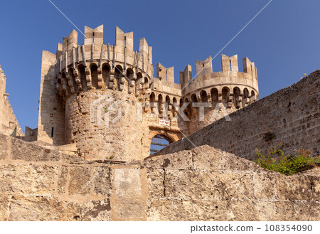 Stone towers and walls of old medieval fortifications on the Island of Rhodes. Stone towers and walls of old medieval fortifications on the Island of Rhodes. 108354090