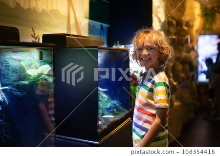 Family in aquarium. Kids watch fish, marine life 108354418