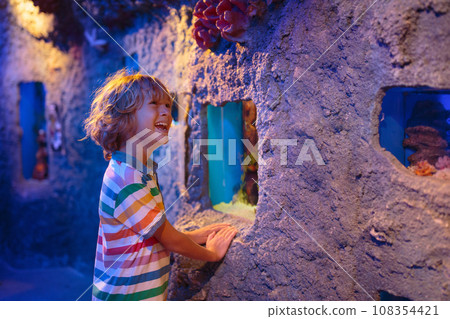 Family in aquarium. Kids watch fish, marine life 108354421