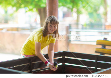 Kids feed animals at petting zoo. Kids feed animals at petting zoo. 108354589